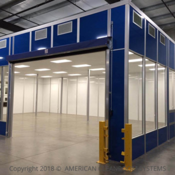 white interior cleanroom walls, roll up door in open position, blue modular cleanroom