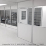 interior eliquid modular cleanroom, floor to ceiling windows, storage racks