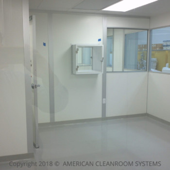 cleanroom pass thru, gray epoxy flooring, white modular cleanroom walls