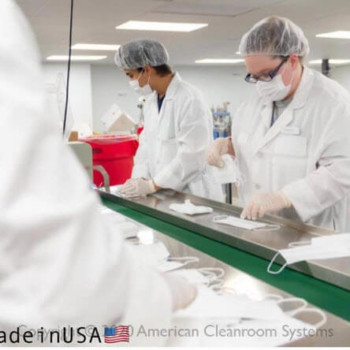 inside ISO8 clearoom, personnel making surgical masks