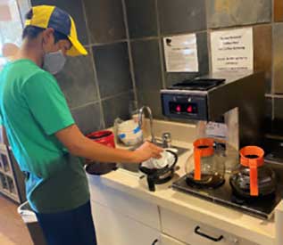 volunteer making coffee