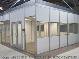 Modular cleanroom, floor to ceiling glass walls, white panels