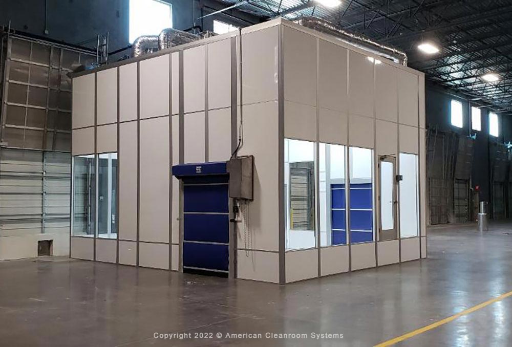 high bay chemical filling cleanroom, two motorized roll up doors, floor to ceiling windows