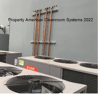Cleanroom AC units on ground outside, copper piping into cleanroom exterior wall