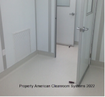 interior of ISO-7 modular cleanroom, white heat welded vinyl flooring with integral cove, cleanroom door
