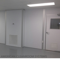 interior of ISO-8 modular cleanroom, gray epoxy cleanroom flooring, white modular cleanroom walls