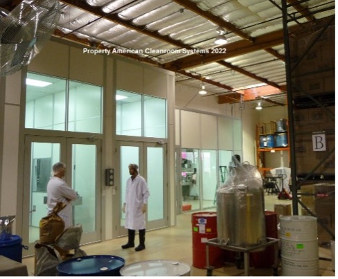 high bay beverages modular cleanroom, glass cleanroom walls, workers