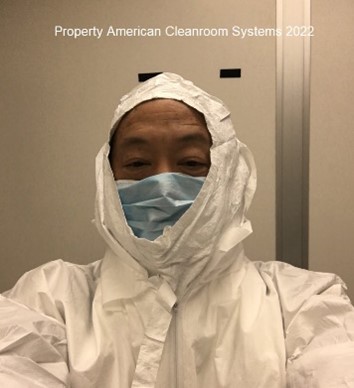 person in cleanroom bunny suit