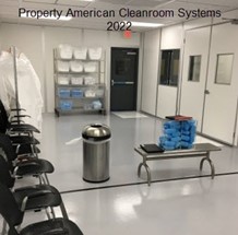 cleanroom gown room, bench, rack of cleanroom garments