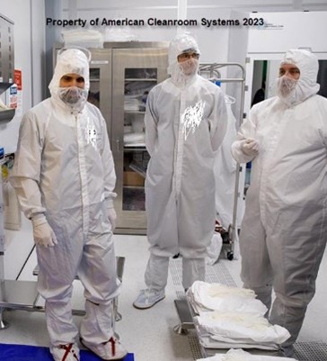 3 people in cleanroom bunny suits, cleanroom garments