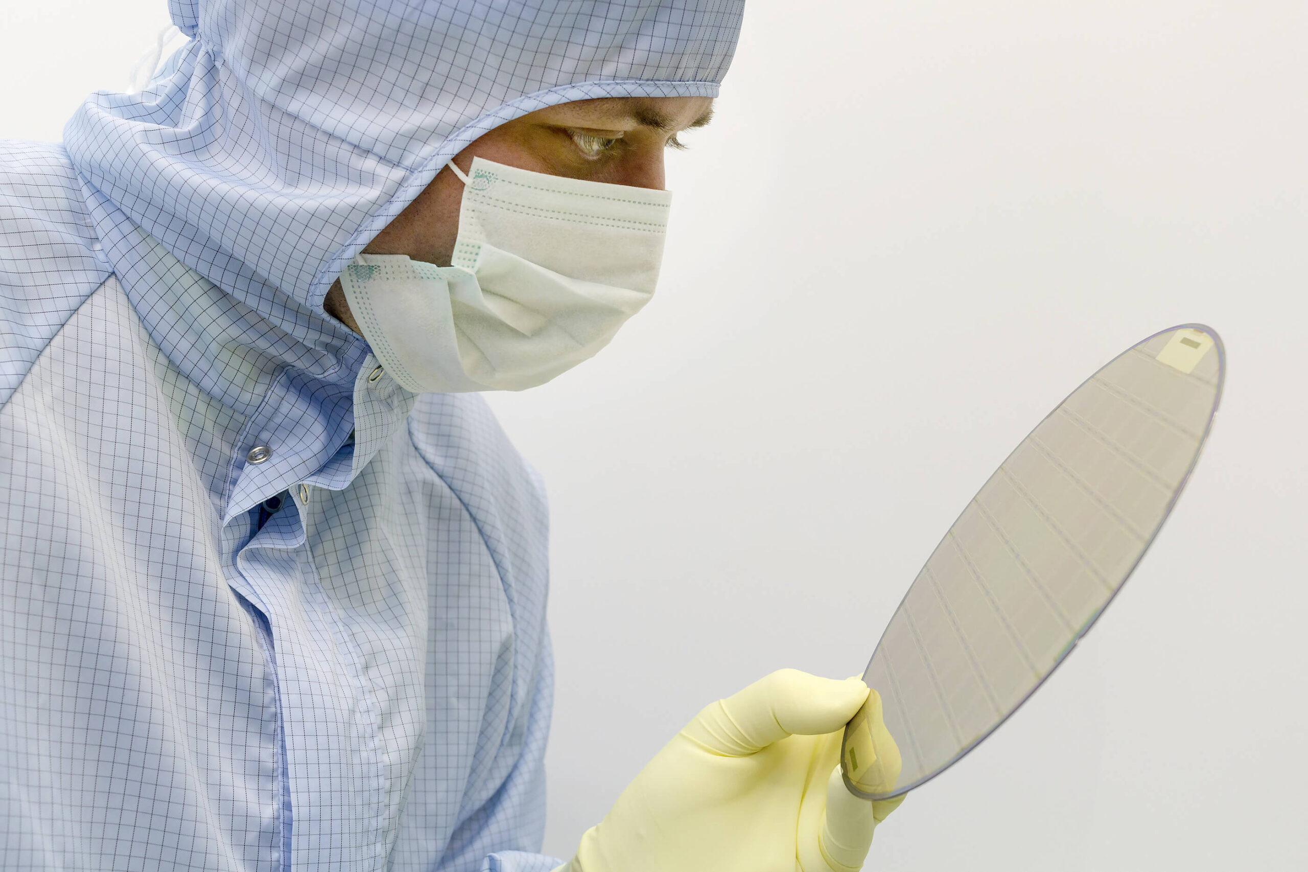 semiconductor wafer, person in bunny suit