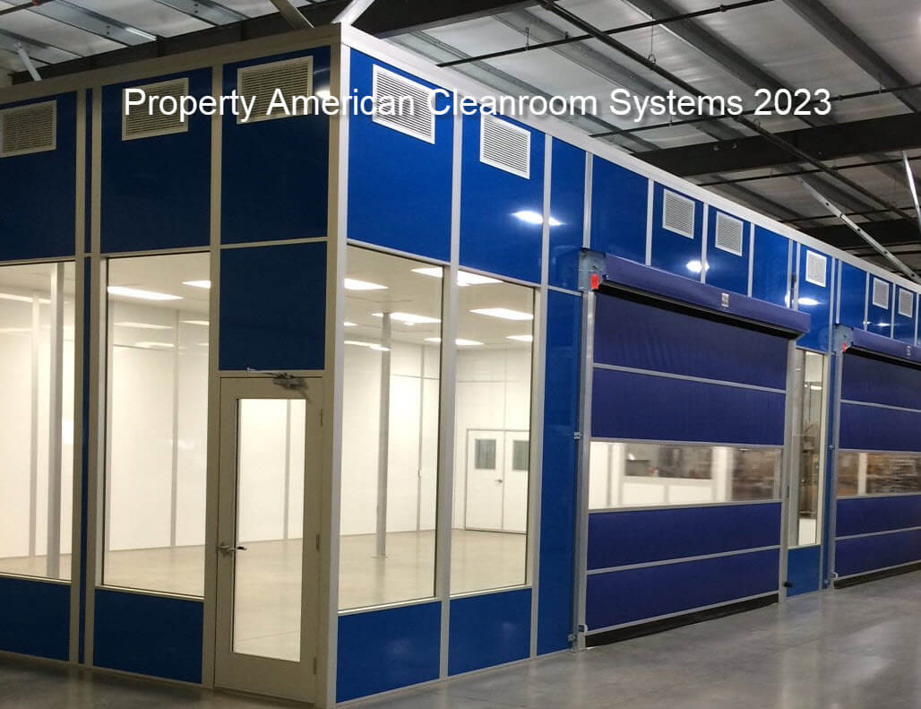 exterior blue high bay cleanroom, floor to ceiling windows, 15’x10 blue motorized roll up doors