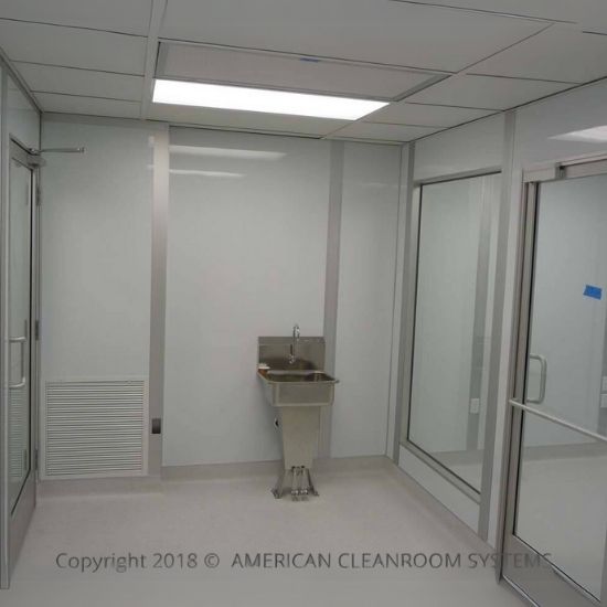 white interior cleanroom walls, roll up door in open position, blue modular cleanroom