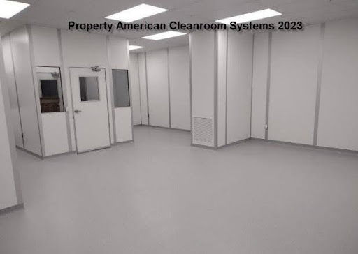 interior of class 1000 modular cleanroom, amber lighting, cleanroom doors, low wall air return