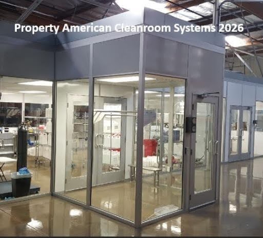 interior of class 1000 modular cleanroom, amber lighting, cleanroom doors, low wall air return